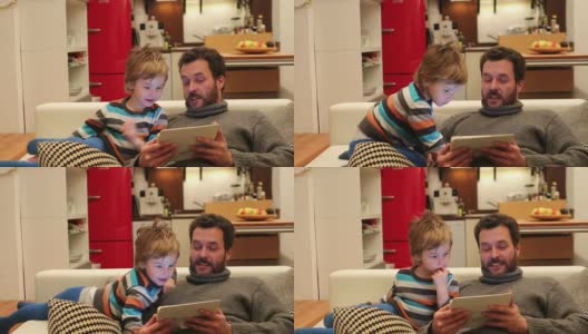 父亲和儿子放松平板电脑高清在线视频素材下载