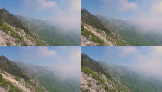 雾蒙蒙的森林，鸟瞰穿越云雾高清在线视频素材下载