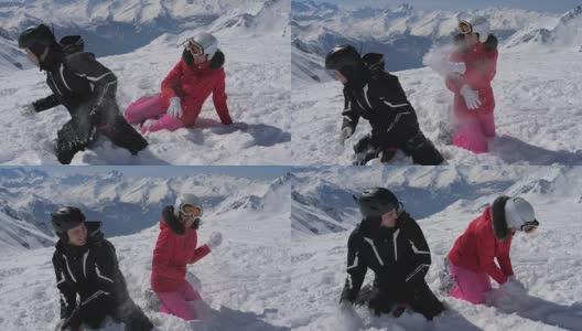 在高山度假村，一对兴高采烈的滑雪者在玩雪球高清在线视频素材下载
