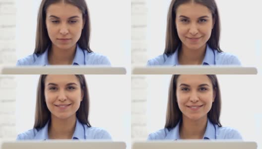 在工作中微笑快乐的女人的特写，笔记本电脑高清在线视频素材下载