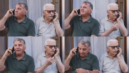两个老人正在和他们的智能手机通电话高清在线视频素材下载