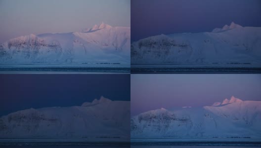 北极山坡上冉冉升起的太阳。在霍恩松德峡湾附近。高清在线视频素材下载