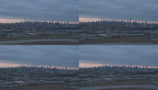 航拍:黎明时分的新泽西工业区和纽约市中心曼哈顿天际线高清在线视频素材下载