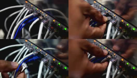 计算机工程师正在修理一个网络集线器交换机高清在线视频素材下载