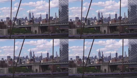 从布鲁克林桥上看纽约市的天际线和曼哈顿桥。金融中心的概念，现代商业城市，美国的城市生活。高清在线视频素材下载