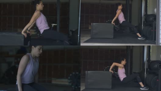 吸引人的民族妇女在家庭健身房做手臂锻炼高清在线视频素材下载