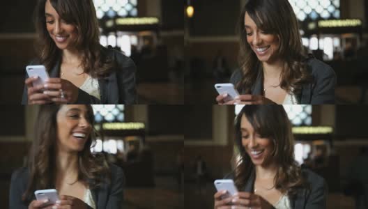 iPhone上年轻漂亮的女商人。视频聊天，笑容满面。高清在线视频素材下载