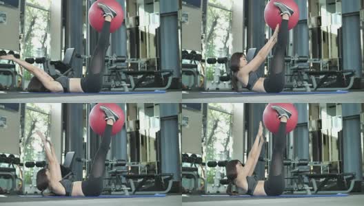 女人用健身球做运动高清在线视频素材下载
