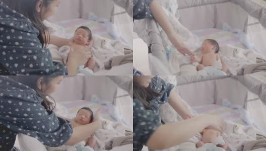快乐的亚洲可爱儿子新生婴儿睡觉。新出生的。高清在线视频素材下载