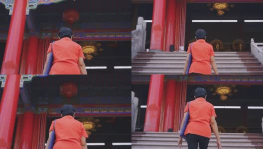 亚洲大妈在寺庙拜佛。高清在线视频素材下载