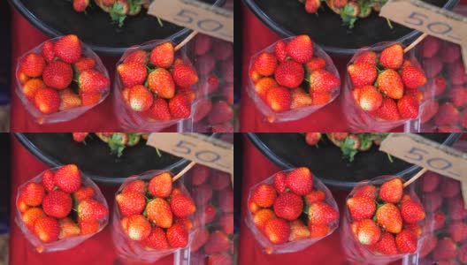 农贸市场上一袋袋新鲜的生态有机草莓的俯视图高清在线视频素材下载