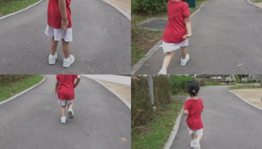 一个小女孩在跑道上跑步高清在线视频素材下载