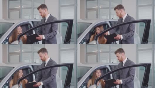 汽车经销商展示女性买家在沙龙新汽车高清在线视频素材下载