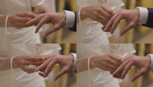 在宣誓仪式上把结婚戒指戴在新郎的手指上高清在线视频素材下载