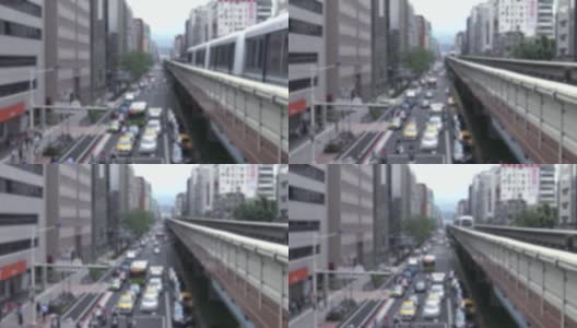 模糊散焦高架列车行驶在台北市的一条交通线上高清在线视频素材下载