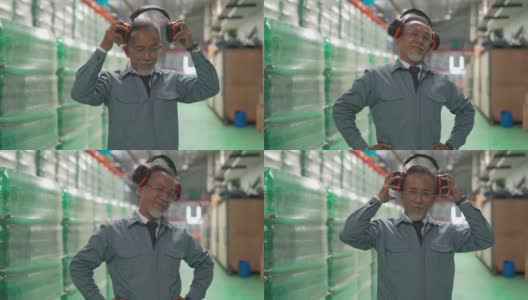 有趣的高级男性肖像亚洲中国仓库工厂经理看着相机做鬼脸高清在线视频素材下载
