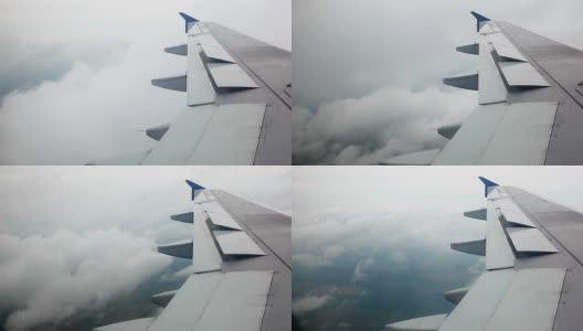 飞机的机翼在云层中飞行高清在线视频素材下载