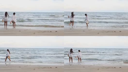 一对女孩享受和放松在海滩上高清在线视频素材下载