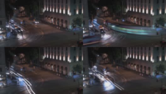 离焦镜头的时间间隔，从高架视野的街道上与电车在夜间行驶高清在线视频素材下载