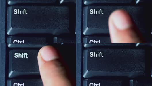 人体手指按下电脑键盘上的shift键的特写高清在线视频素材下载