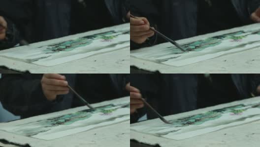 中国艺术家用毛笔实时画国画。高清在线视频素材下载