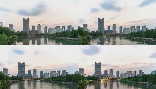 杭州河边的现代化办公大楼。从白天到晚上的时间间隔为4k高清在线视频素材下载