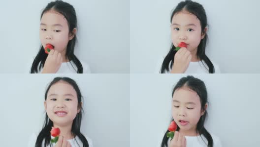 吃草莓的亚洲女孩。高清在线视频素材下载