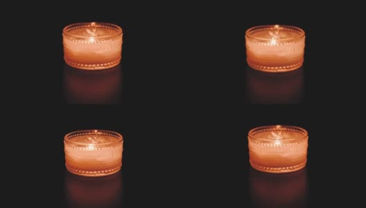 孤立的香薰蜡烛燃烧与黑暗的背景高清在线视频素材下载