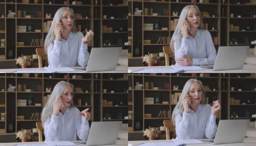 成熟的女企业家通过电脑与客户进行电话交谈高清在线视频素材下载