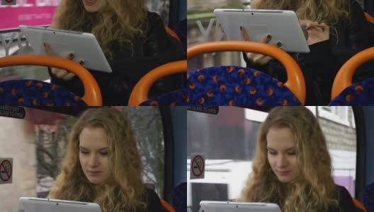 年轻女子在公车上拿着平板电脑高清在线视频素材下载