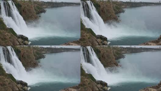 瀑布流入港口，后面是城市，安塔利亚高清在线视频素材下载