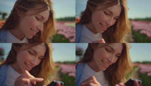 快乐女孩滑动手机屏幕外面。情感女孩在网上交流高清在线视频素材下载
