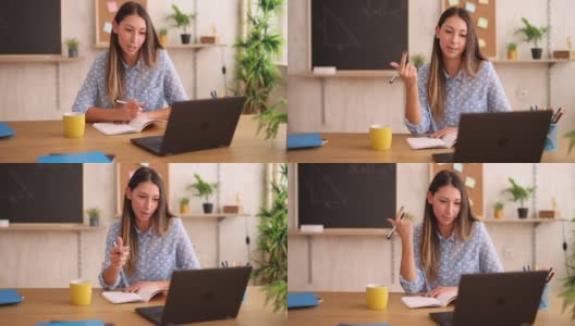 女数学老师在家里用笔记本电脑在线讲课高清在线视频素材下载