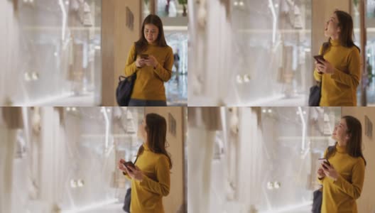 逛商场的女人，逛时装店的橱窗高清在线视频素材下载