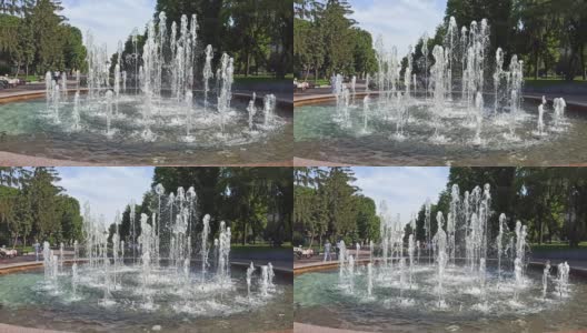 城市公园里的喷泉。阳光明媚的夏天高清在线视频素材下载