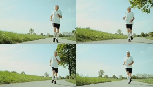 SLO MO TS高级马拉松运动员在一个阳光明媚的日子里跑步高清在线视频素材下载