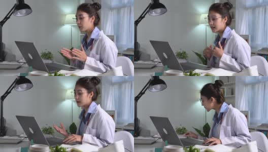 年轻漂亮的亚洲女医生在医务室，与病人进行在线会诊。年轻女医生用听诊器进行视频通话高清在线视频素材下载