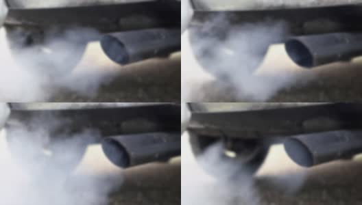 慢动作和散焦燃烧烟雾从汽车排气管烟雾高清在线视频素材下载