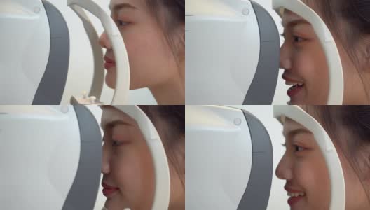 特写:亚洲年轻女子在眼科医生的办公室用专业设备检查她的视力高清在线视频素材下载