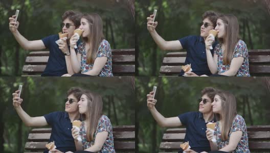 年轻情侣在公园里吃冰淇淋，然后自拍高清在线视频素材下载