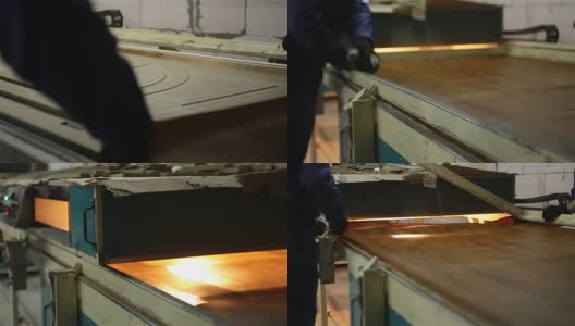 工人们用一层塑料膜盖住门的表面。高清在线视频素材下载