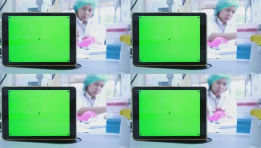 绿色屏幕与科学家在实验室工作高清在线视频素材下载