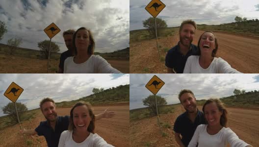一对年轻夫妇与袋鼠标志自拍，澳大利亚高清在线视频素材下载