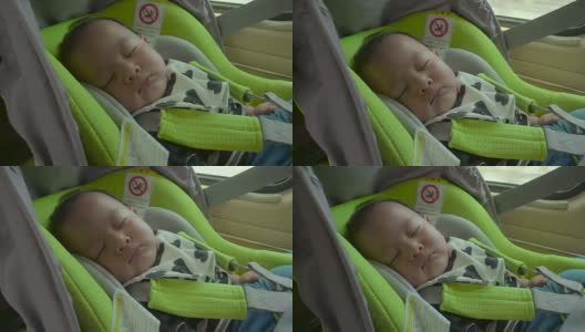 小婴儿睡在安全座椅上。高清在线视频素材下载