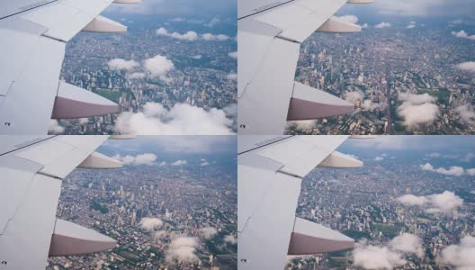 飞机机翼穿过云层和曼谷城高清在线视频素材下载