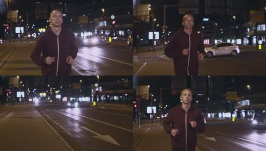 SLO MO TS男子晚上在城市街道上慢跑高清在线视频素材下载