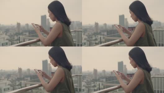 亚洲女性使用智能手机与朋友聊天。高清在线视频素材下载