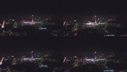 2018年新年前夜的庆祝活动的美丽航拍镜头，在印尼雅加达中部的国家纪念碑上，闪耀的烟花高清在线视频素材下载