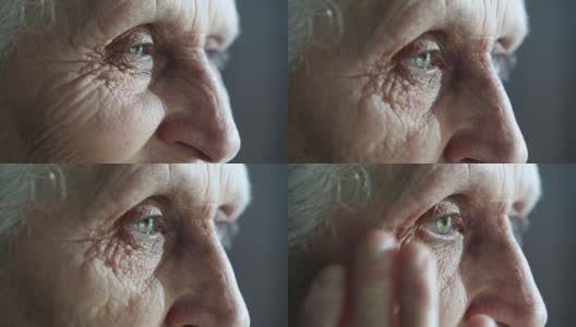 哭泣的老妇人用手擦干眼泪高清在线视频素材下载