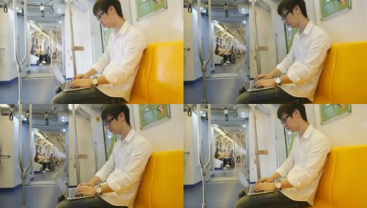 年轻人在火车上使用手提电脑高清在线视频素材下载